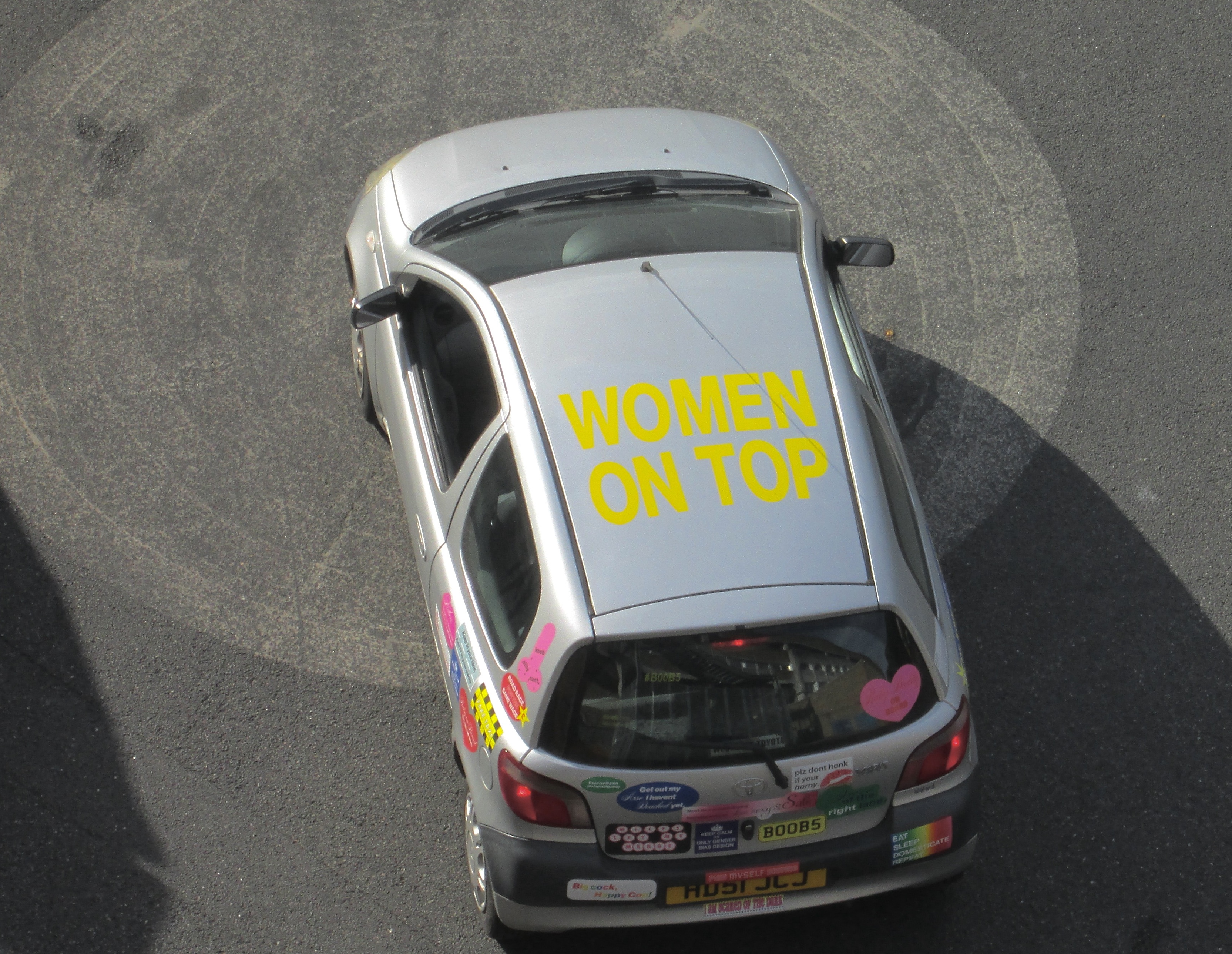 Car roof reading Women on Top